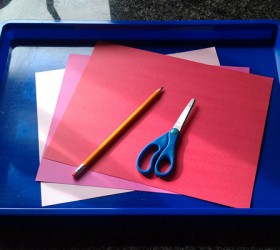 Making cute homemade handprint Valentine's Day cards.