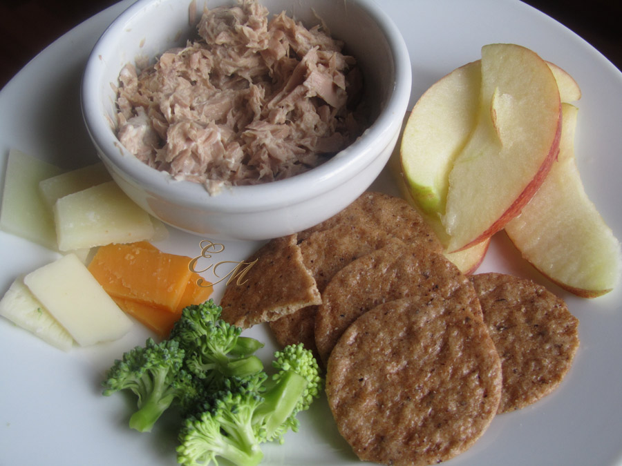 Kid Lunch with Tuna, crackers, apple slices, cheese and broccoli.