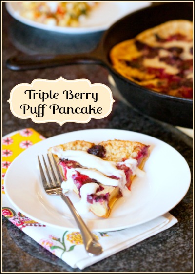 Oven baked triple berry puff pancake with sweet and tart lemon-vanilla yogurt