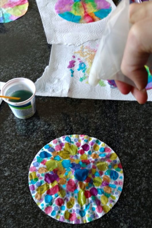 This watercolor snowflake craft is easy, fun, and a little bit addictive. It'll keep you and your kids busy for a long while. // evolvingmotherhood.com